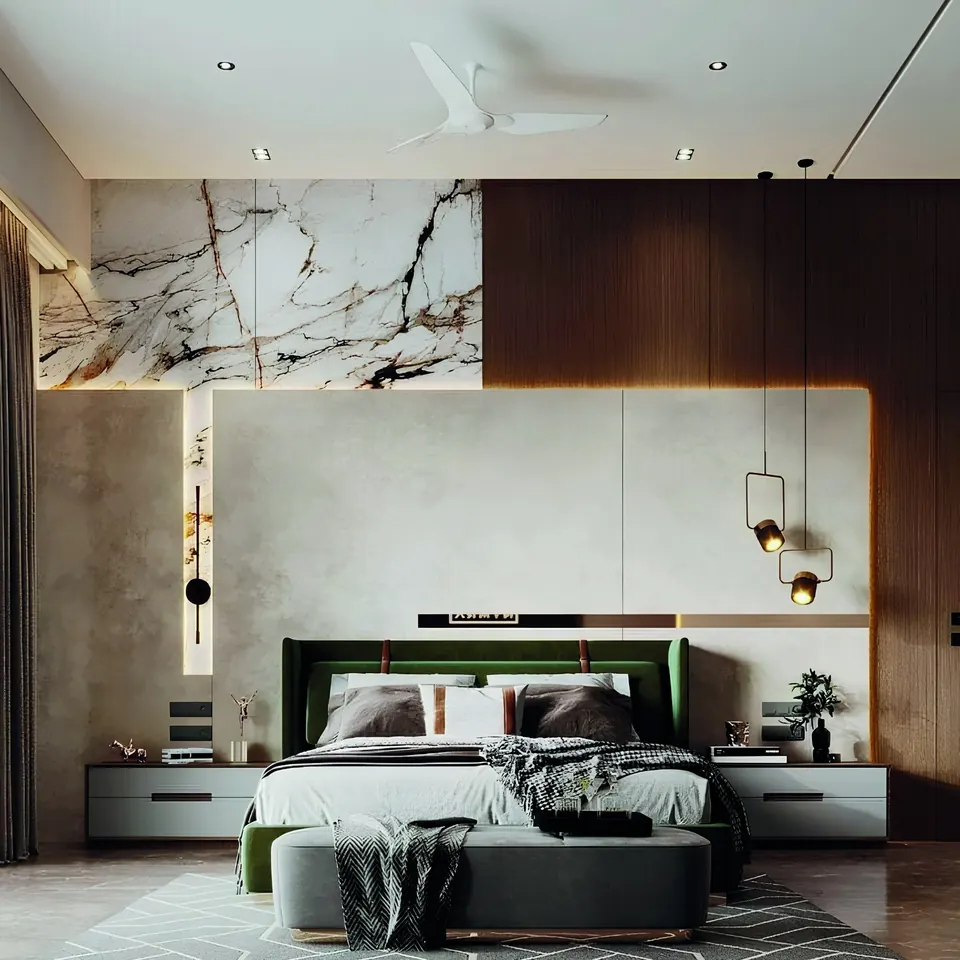 A contemporary bedroom with a marble-look feature wall, walnut panels and a green upholstered bed