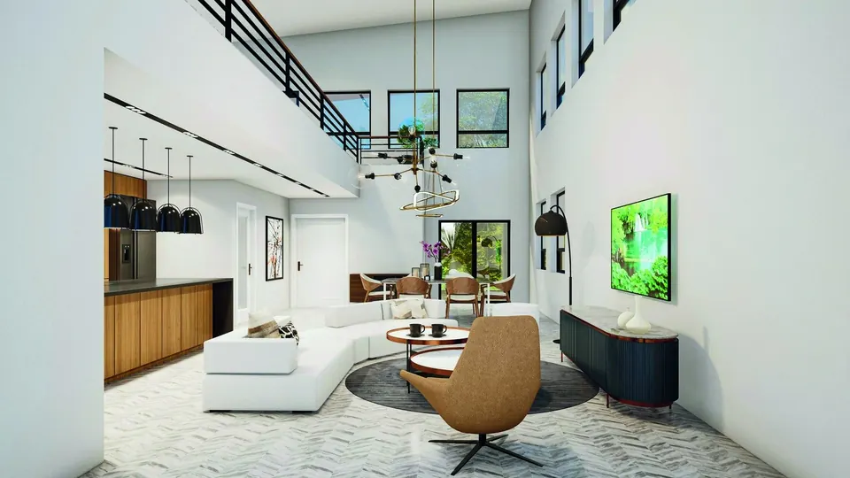 A modern open-plan apartment living room with a kitchen and dining beyond